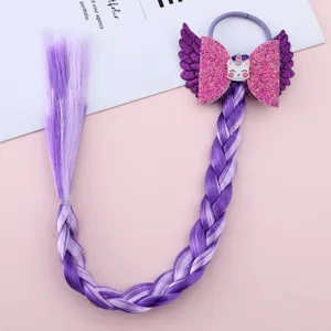 Detailed close-up view of the purple synthetic braided wig featuring glittering bow and cute unicorn wings.