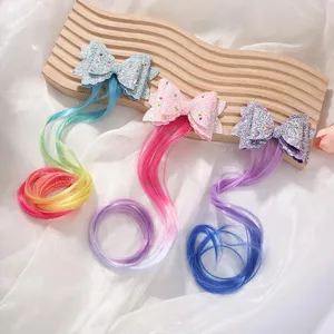 Cute glitter bow hair clips with colorful gradient hair extensions, perfect for kids' styling.
