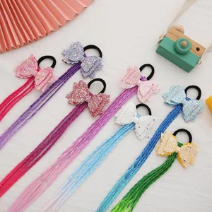 Leuke glitter strik haarrekkers met kleurrijke gevlochten koorden voor meisjes. Mooi haaritem.