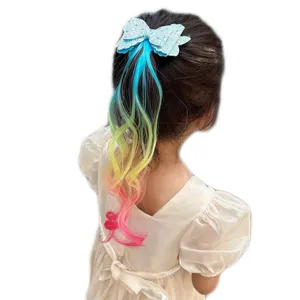 Cute kids glitter bow hair clip with colorful gradient hair extension detail shot for girls.
