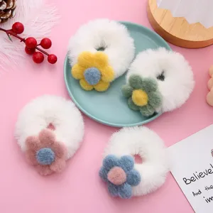 Cute plush flower hair scrunchies detail view, soft fuzzy winter hair ties for sweet girls.