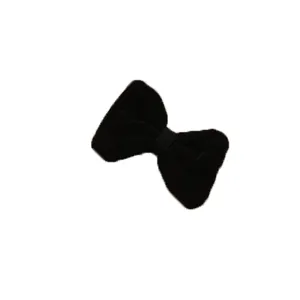Close up of black velvet bow hair clip, showing delicate fabric texture and design.