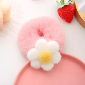 Sweet pink plush hair scrunchie with cute white flower detail, soft autumn winter hair tie.