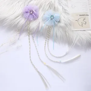 Girl's hair clips with long braided hair extensions, mesh bows and sparkling rhinestones.