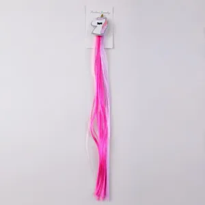 Colorful unicorn synthetic hair extension clip detail shot with long gradient strands.