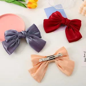 Elegant large satin bow hair clip for women, stylish ponytail barrette hair accessories.