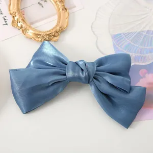Exquisite blue satin bow hair clip detail close up elegant women headwear accessory