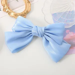 Light blue satin bow hair clip for women, sweet and elegant hair accessory for daily wear.