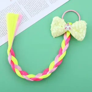 Colorful wig braid hair tie with sequin bow and cute unicorn cartoon detail for kids.