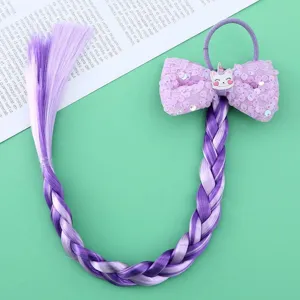 Detailed view of kids colorful wig braid hair tie with sequin bow and unicorn decor