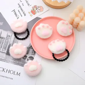 Cute plush cat paw hair ties, soft pink and white fuzzy design with elastic rubber bands for girls.