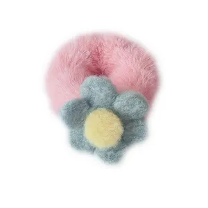 Fluffy pink plush hair scrunchie with cute grey flower for sweet autumn winter styles.