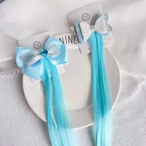 Detailed view of cute blue bow hair clip with long straight synthetic hair extension pieces.