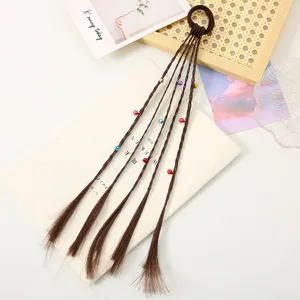Close-up detail of brown braided hair tie extension featuring colorful beads for kids party.