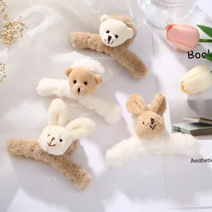 Plush bear and bunny hair claw detail view, cute fluffy shark clip closeup in aesthetic style.