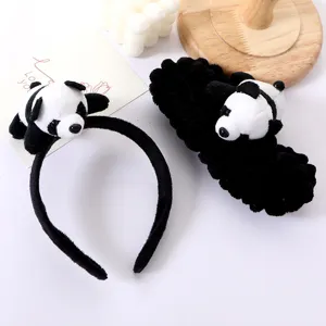 Close-up of cute panda plush headband and furry hair clip, soft animal hair accessories.