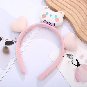 Cute plush cat headband detail, soft hair hoop for daily makeup and skincare routine.
