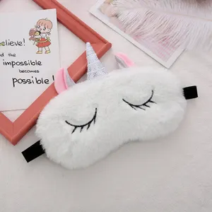 Plush unicorn sleep mask, soft white fuzzy eye cover with cute glitter horn for travel sleep.