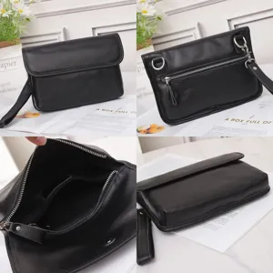 Details of black leather waist bag, metal zipper pocket and shoulder strap close-up view.