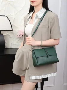 Dark green genuine leather shoulder bag detail, elegant cowhide crossbody bag for daily.