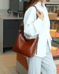 Classic genuine leather hobo shoulder bag with stylish woven wide strap for women