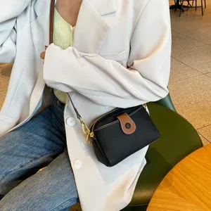 Classic genuine leather small crossbody bag for women, elegant casual shoulder handbag detail.