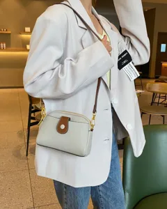 TOGO leather crossbody bag for women, stylish minimalist shoulder bag with contrast color.