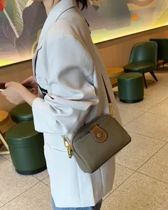 TOGO genuine leather crossbody bag for women, stylish casual shoulder bag with metal hardware.