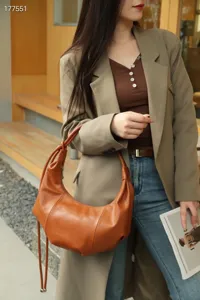 Retro brown crescent hobo bag, stylish pleated shoulder bag for women, chic daily commuter handbag.