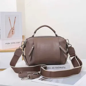 Genuine leather crossbody bag for women, stylish top-handle shoulder purse with wide strap.