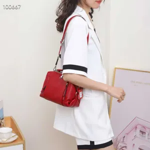 Genuine leather red crossbody bag for women, stylish and spacious shoulder handbag detail.