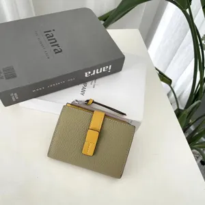 Compact genuine leather women wallet with color block design, snap closure and zipper coin pocket.