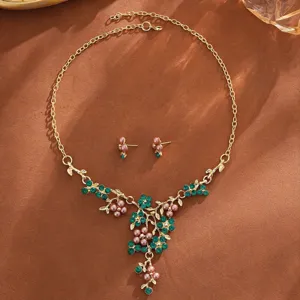 Gold-tone necklace earrings set with green crystals pink pearls floral vine design wedding.
