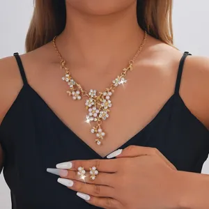 Gold pearl floral necklace and ring set, elegant bridal jewelry for weddings and parties.