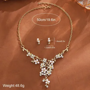 Gold-plated pearl flower necklace and earrings set with sparkling rhinestones for women.