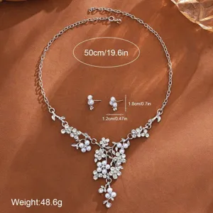 Pearl flower necklace earrings detail shot, elegant silver jewelry design with crystals.