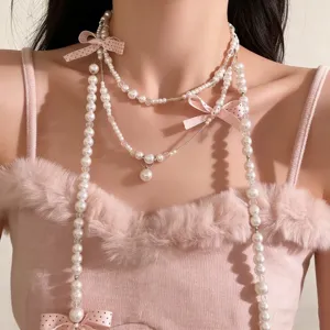 Süße Perlen Schleife mehrlagige Quasten Halskette Detail, elegante Kette für Damen.