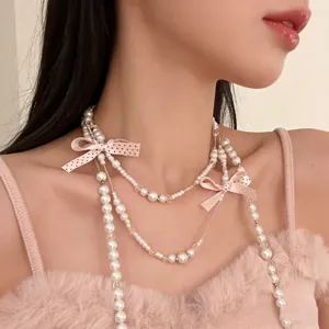 Süße Perlen Schleife mehrlagige Halskette mit zarten Quasten für elegante Damen.