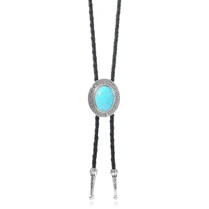 Turquoise bolo tie pendant detail showing intricate retro relief pattern and braided cord.
