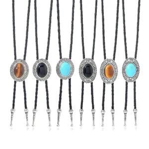 Vintage western bolo tie with oval gemstone pendant and braided leather cord details.
