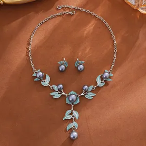 Exquisito juego de collar y aretes de perlas con hojas de cristal azul joyas de boda.