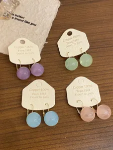 Boucles d'oreilles douces dopamine, style coréen simples boucles rondes en résine pour femmes.