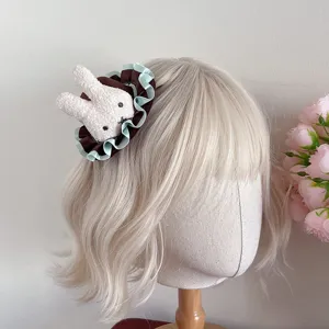 Sweet Japanese lolita rabbit hair clip with brown and mint green ruffles for cute fashion.