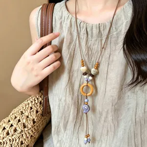 Ethnic style long wooden ceramic necklace with shell pendant for women, bohemian beach jewelry.