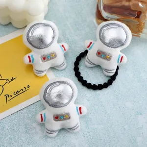 Cute plush astronaut hair tie and brooch accessory, soft fabric with shiny silver visor design.