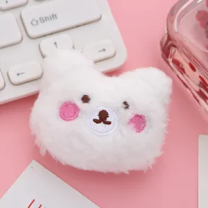Cute white plush bear brooch detail, soft furry animal pin for DIY clothing and bag decor.