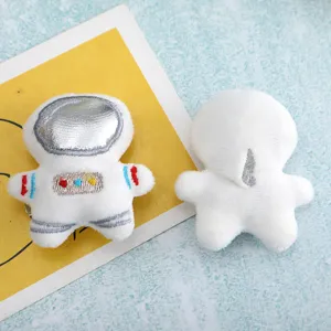 Cute astronaut plush brooch and hair clip accessory, soft white stuffed cute design.