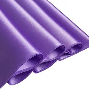 Close-up of purple satin fabric detail with smooth glossy texture and neat hem edge.