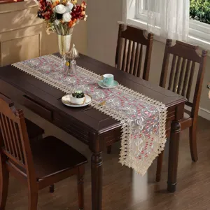 Elegant embroidered lace table runner detail, beautiful dining table decor setting style.