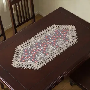 Exquisite lace table runner with elegant floral embroidery, perfect for dining room decor.